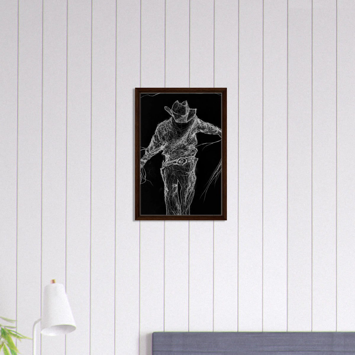 White charcoal drawing on black paper of a cowboy walking toward the viewer with a weathered hat and long shadow, conveying strength, solitude, and quiet determination.