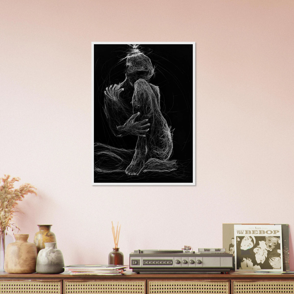 white charcoal drawing of a woman sitting on the ground, gently cradling herself with one nee drawn close to her body, on black paper