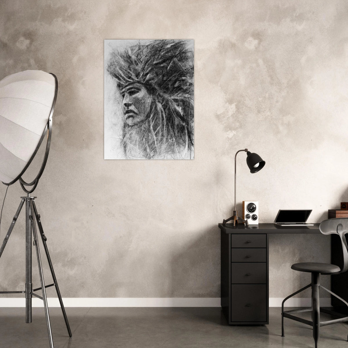 Black charcoal drawing of a native american man wearing an elaborate headdress on white canvas